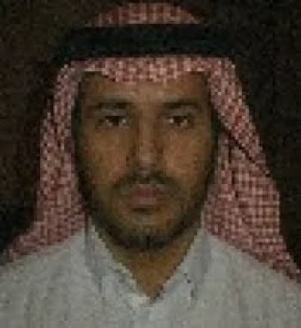 Ahmed smiling in traditional clothes